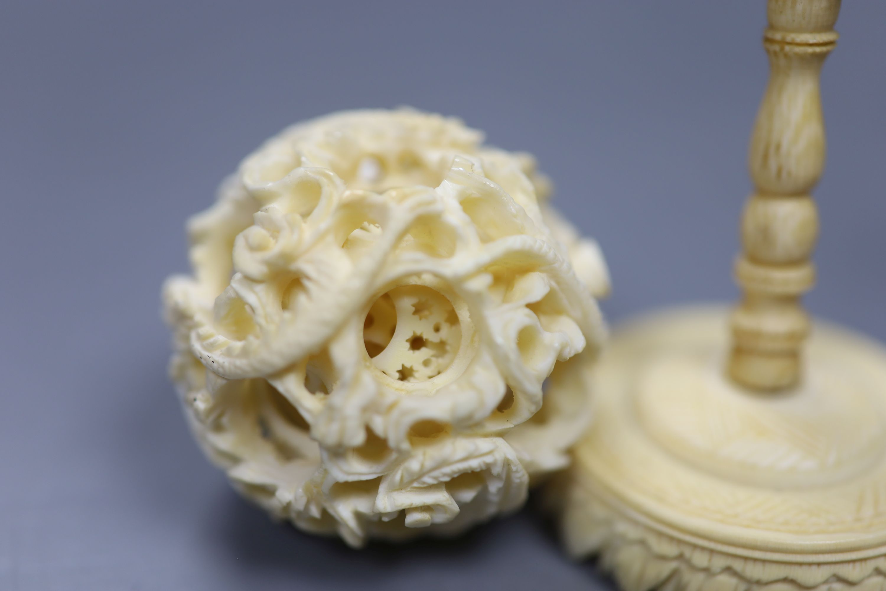 A carved Chinese ivory ball on stand, early 20th century, height 10.5cm